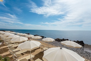Sun loungers, beach umbrellas