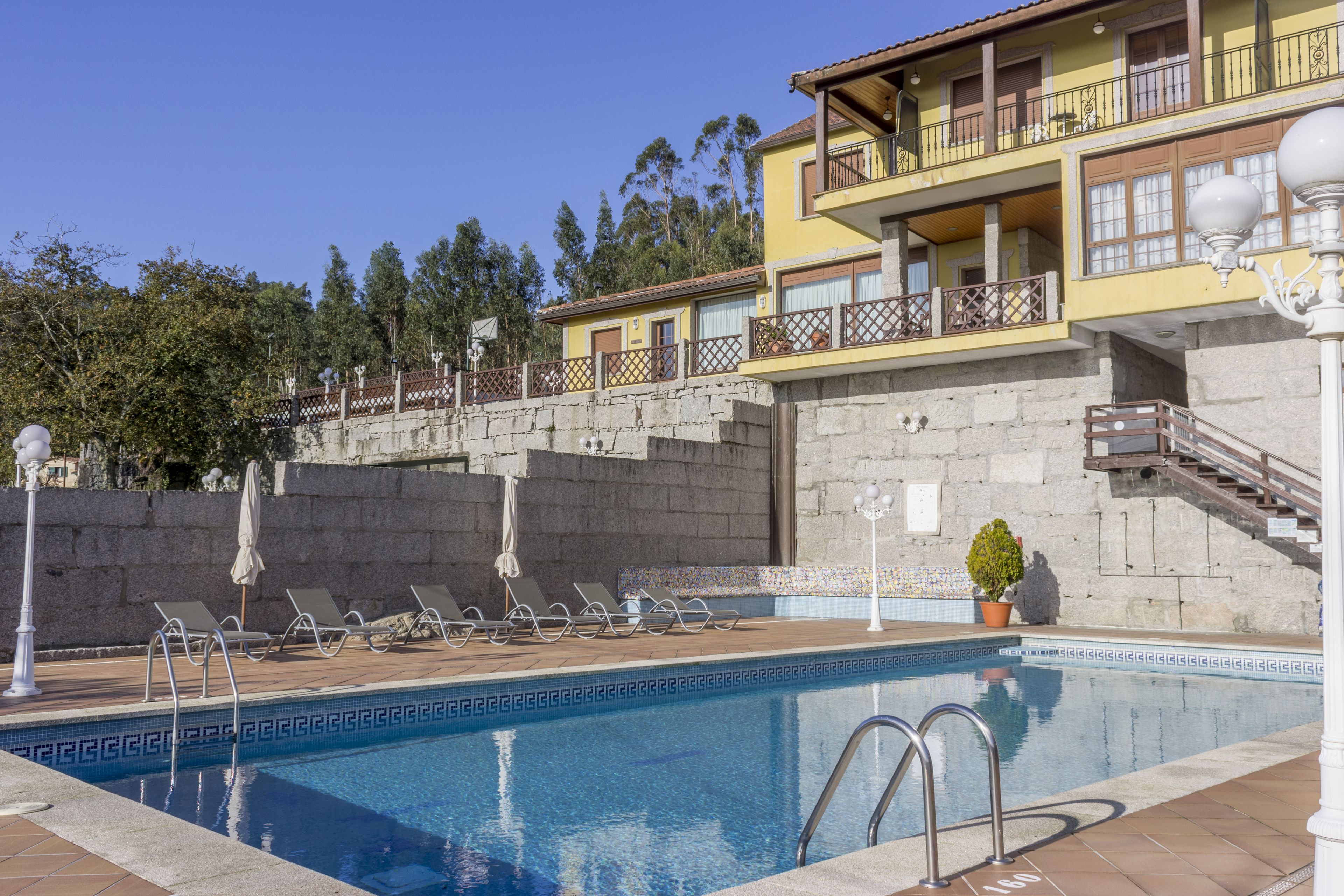 outdoor pool, pool umbrellas, pool loungers