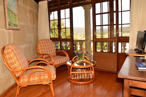Standard Double Room | Living area | Flat-screen TV