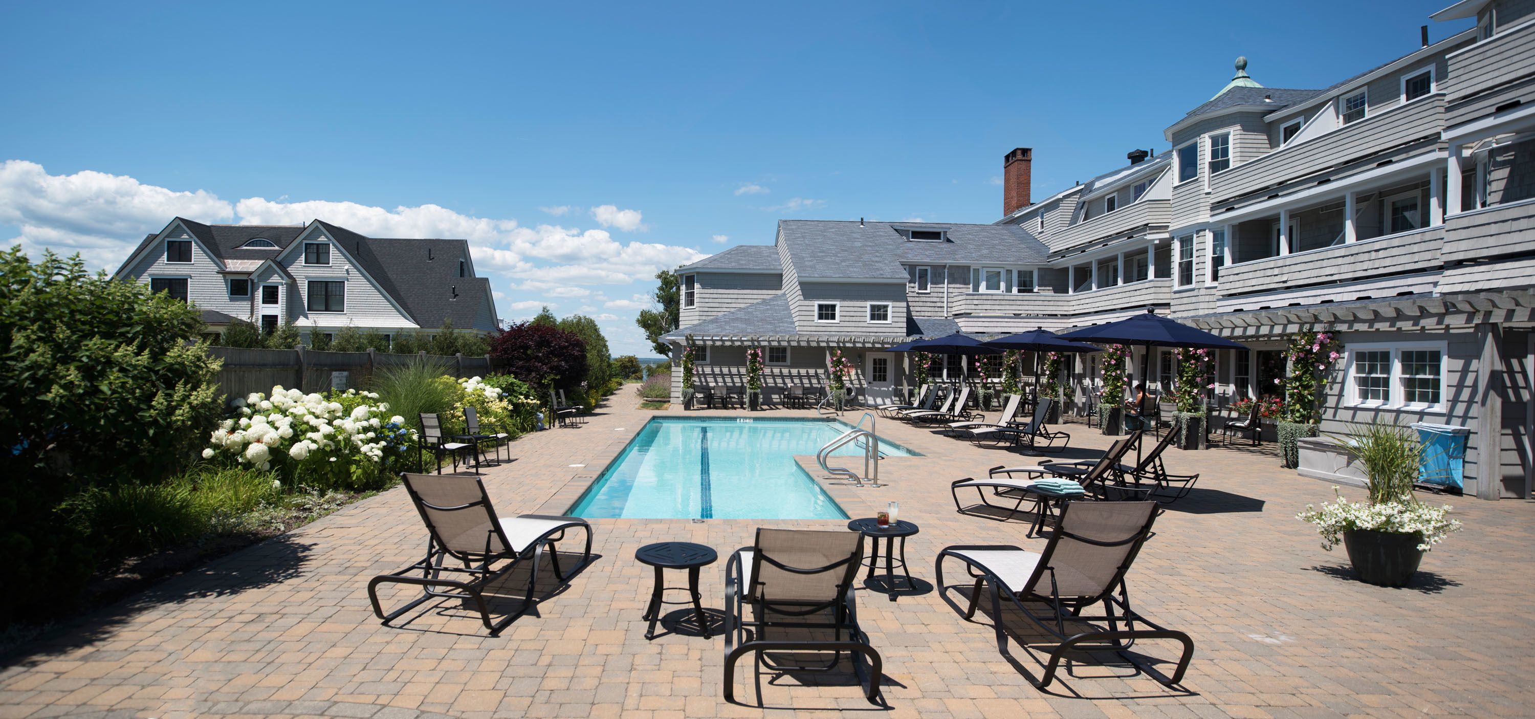 outdoor pool, open 8:00 am to 7:30 pm, pool umbrellas, pool loungers