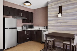 Full-sized fridge, microwave, stovetop, dishwasher