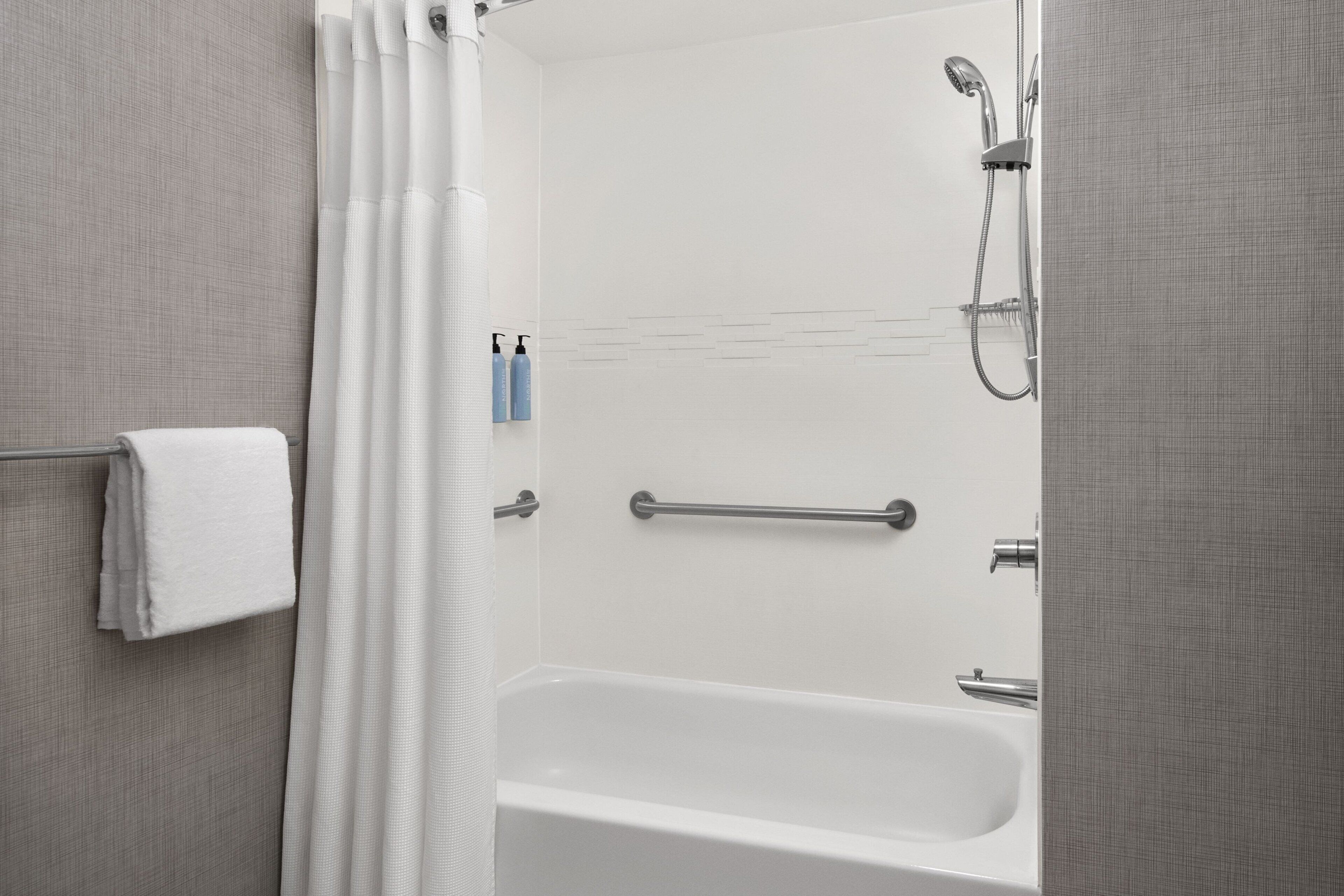 combined shower/bathtub, free toiletries, hair dryer, towels