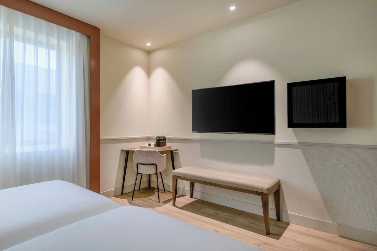 Standardzimmer, 2 Einzelbetten | Minibar, Zimmersafe, kostenloses WLAN, Bettwäsche