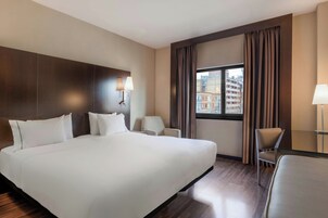 Hypo-allergenic bedding, down comforters, minibar, in-room safe