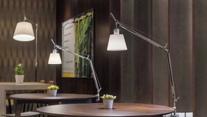 A modern dining area with round tables, potted plants, and pendant lighting. - AC Hotel Zamora by Marriott (Zamora)