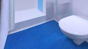 A modern bathroom with a shower, sink, and toilet. - Travelodge Derby Cricket Ground (Derby)