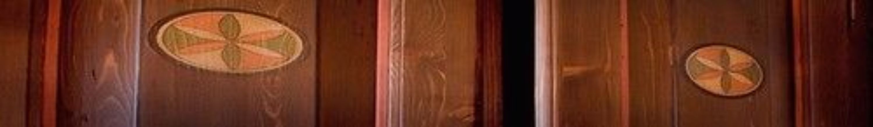 A wooden door with circular patterns.