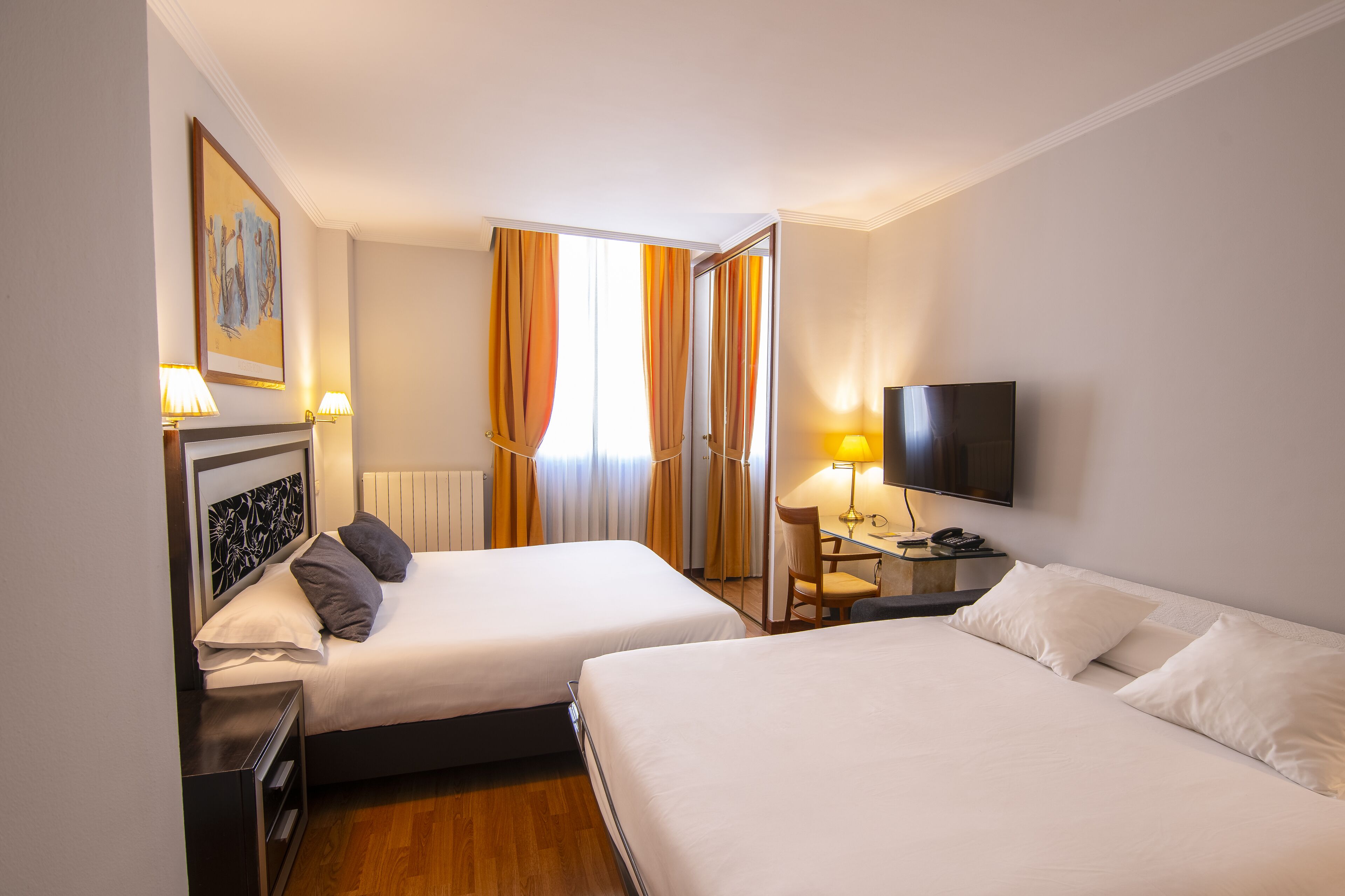 family room | 1 bedroom, minibar, in-room safe, desk