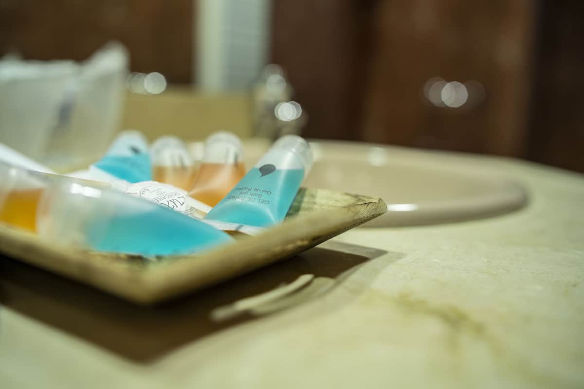 bathtub, hair dryer, bidet, towels