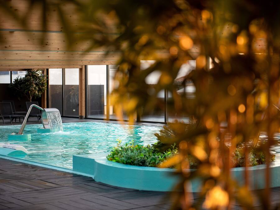 Indoor pool, pool umbrellas, pool loungers