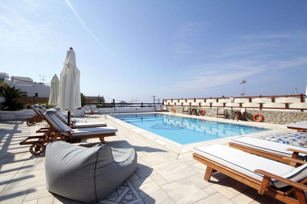 Outdoor pool, pool umbrellas, sun loungers