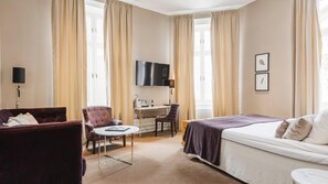 Premium bedding, desk, laptop workspace, iron/ironing board