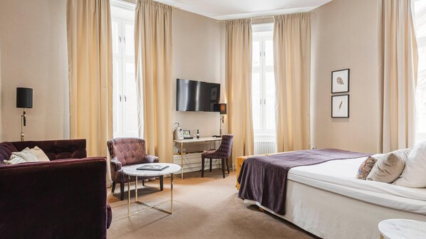 Premium bedding, desk, laptop workspace, iron/ironing board