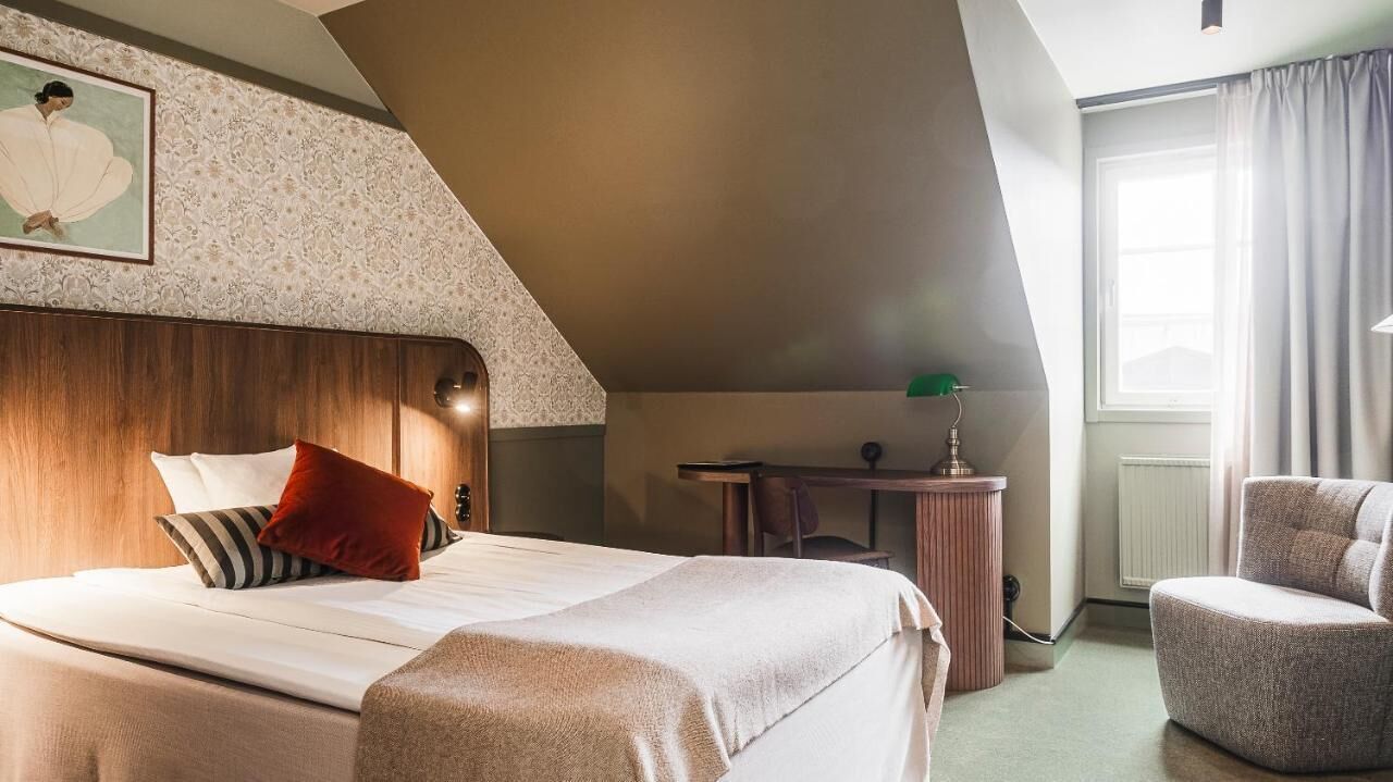 Premium bedding, desk, laptop workspace, iron/ironing board