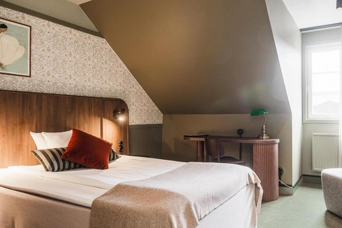 Premium bedding, desk, laptop workspace, iron/ironing board