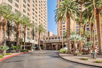 A high-rise hotel with multiple floors, large windows, and a prominent entrance area. at Hilton Grand Vacations Club on the Las Vegas Strip