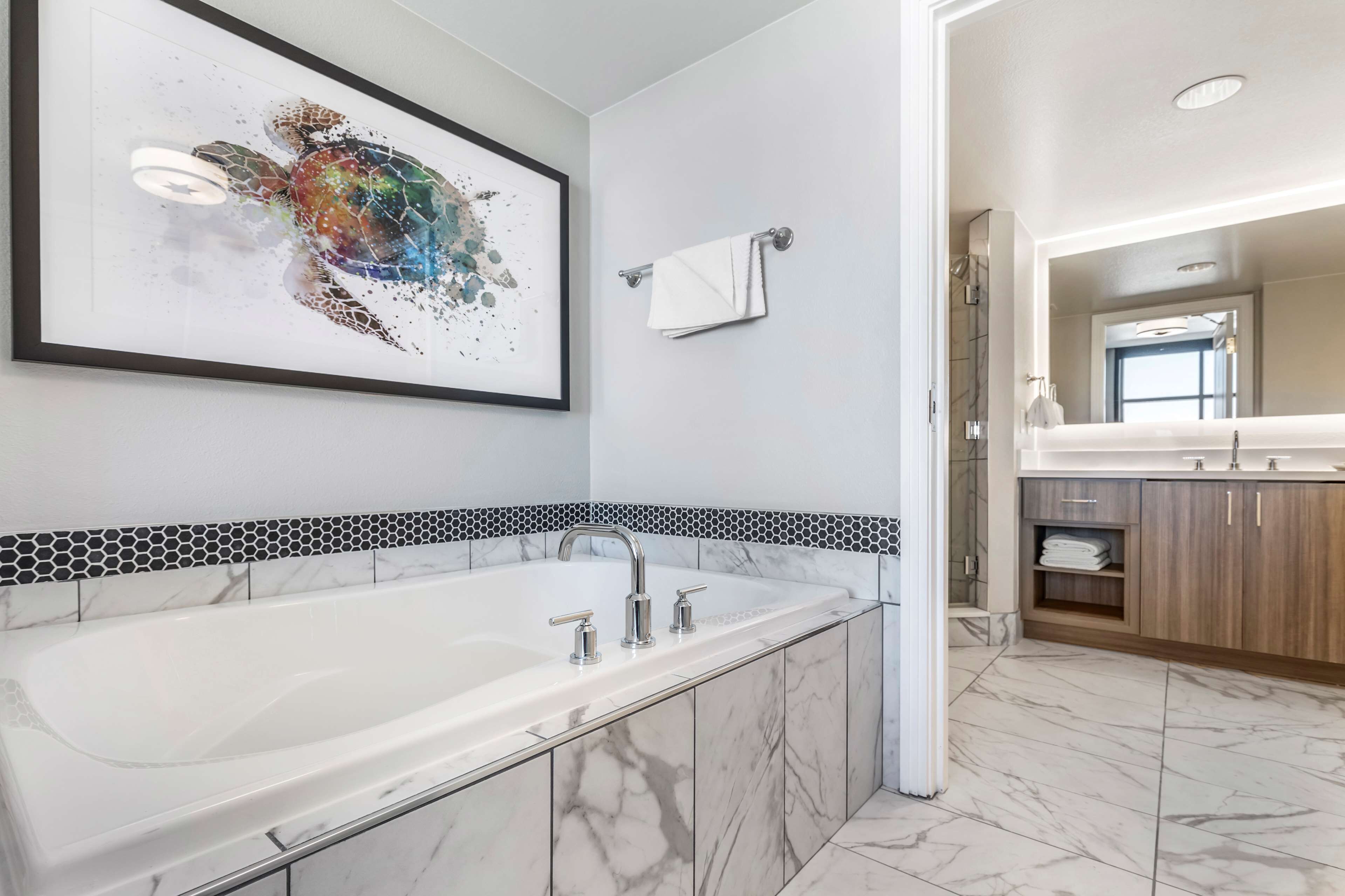 designer toiletries, hair dryer, towels, soap