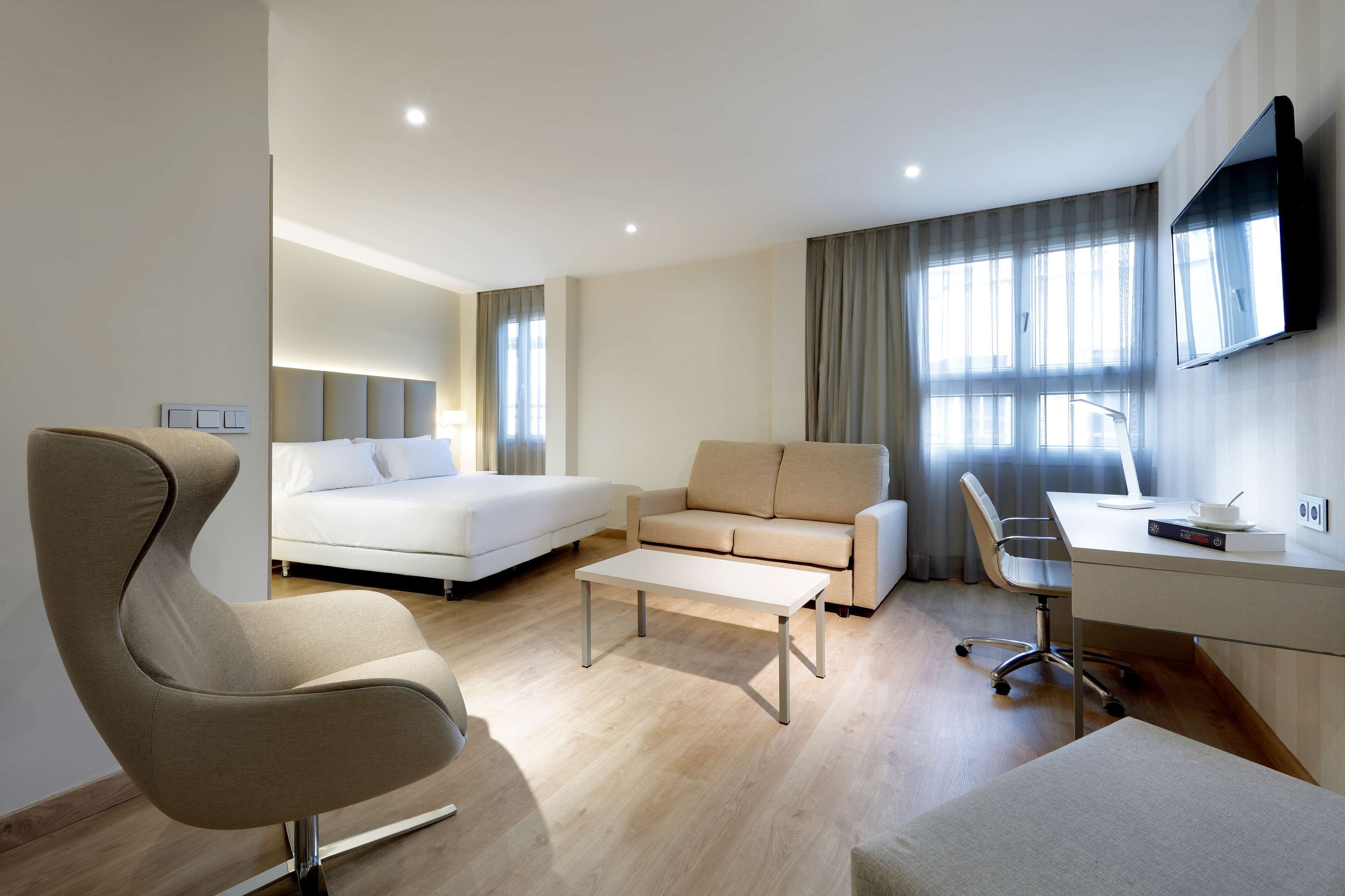 junior suite, city view | minibar, in-room safe, desk, blackout curtains