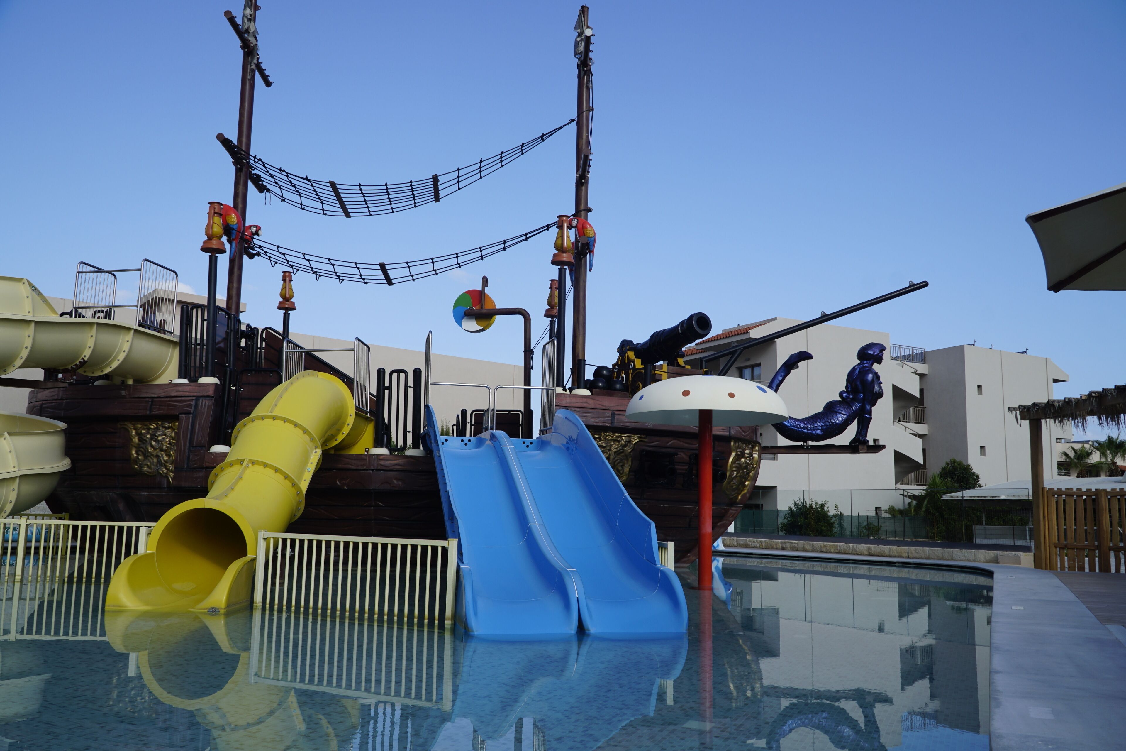 A water park with multiple slides and a pool area.