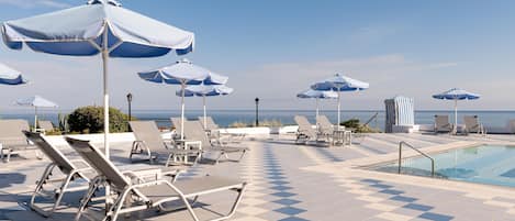 Indoor pool, seasonal outdoor pool, pool umbrellas, pool loungers