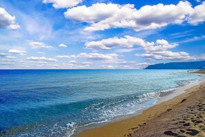 On the beach, sun-loungers, beach umbrellas, beach towels