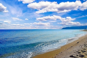 On the beach, sun-loungers, beach umbrellas, beach towels