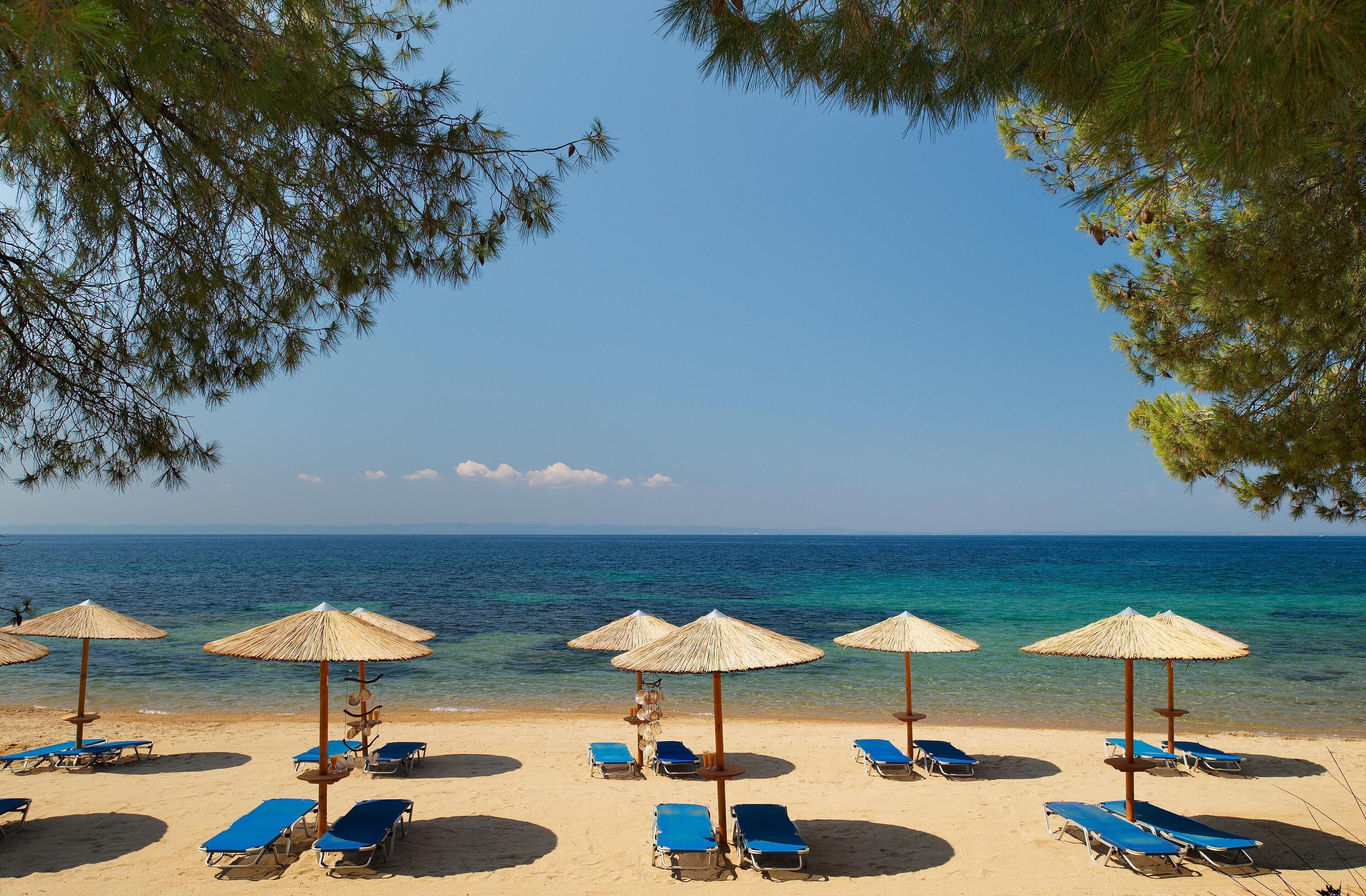 Private beach, beach umbrellas, beach towels, beach volleyball