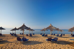 Private beach, beach umbrellas, beach towels, beach volleyball