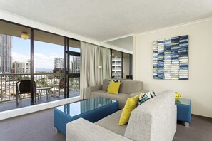 1 Bedroom Apartment | Living area | Flat-screen TV
