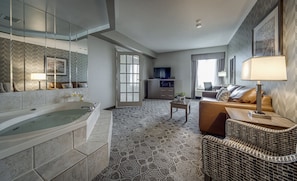 Deluxe King Suite with Jetted Tub-Separate Living Room | Down comforters, in-room safe, desk, blackout drapes