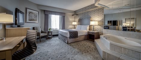 Queen Suite with Jetted Tub | Down comforters, in-room safe, desk, blackout drapes