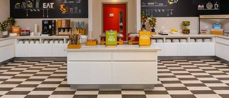 A checkered floor, a counter with food items, and a red door labeled "PANTRY".