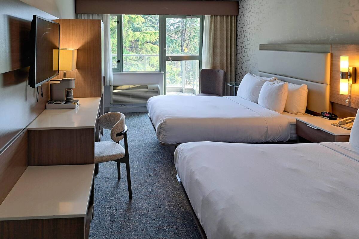 Suite, 2 Queen Beds, Non Smoking | In-room safe, desk, iron/ironing board, free cots/infant beds