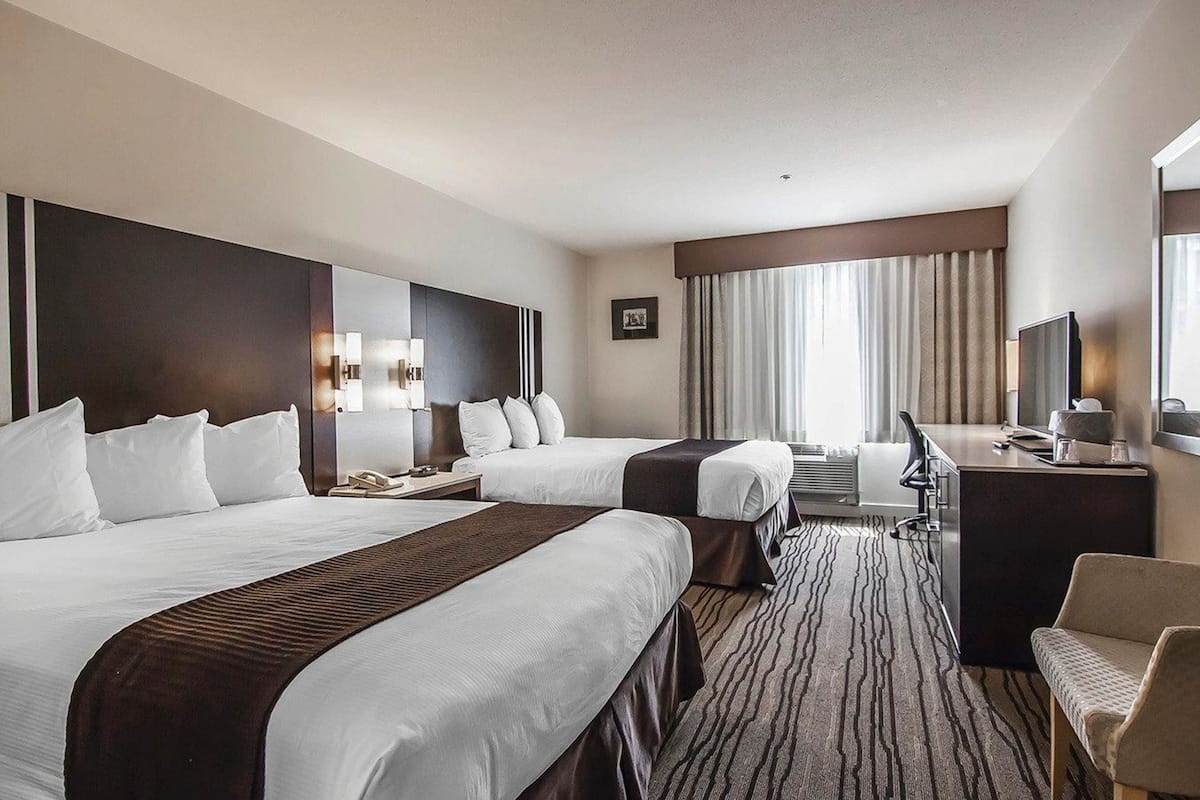 standard room, 2 queen beds, non smoking | in-room safe, desk, iron/ironing board, free cots/infant beds