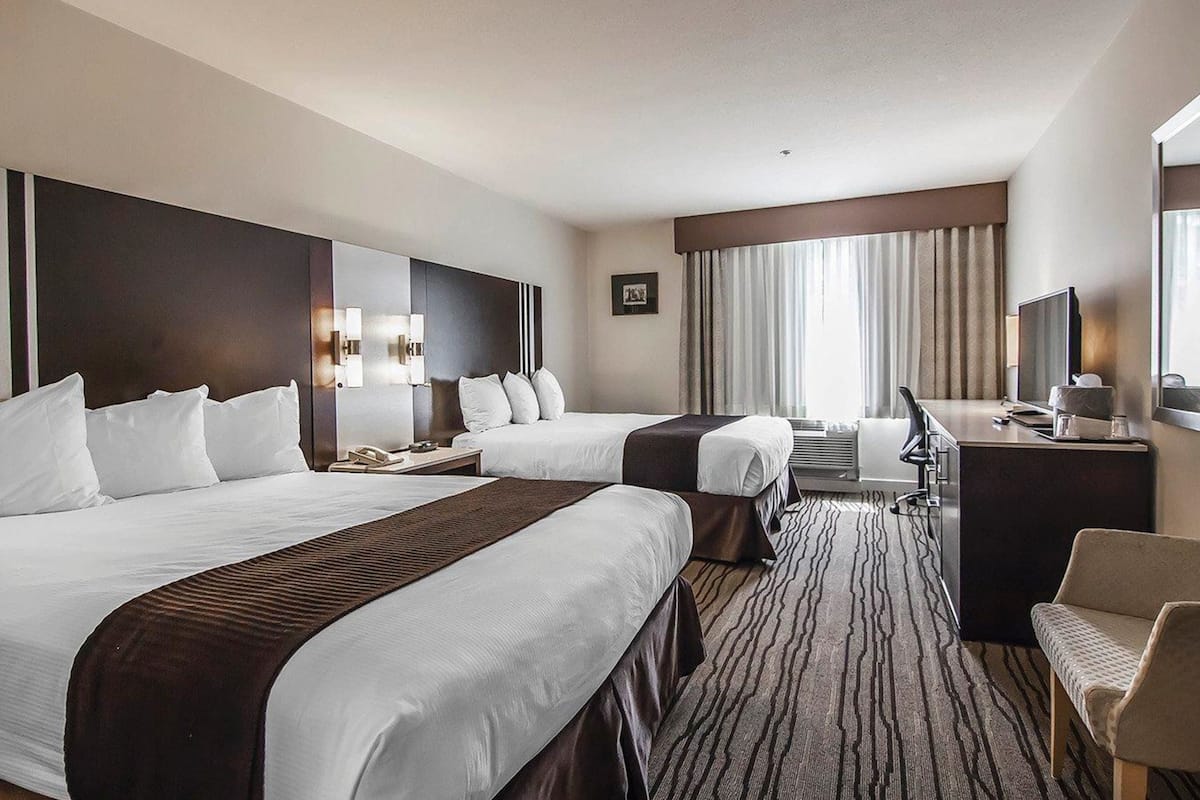 Standard Room, 2 Queen Beds, Non Smoking | In-room safe, desk, iron/ironing board, free cribs/infant beds