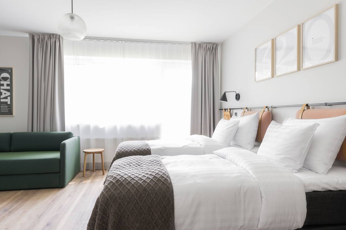 basic triple room | desk, laptop workspace, blackout curtains, soundproofing