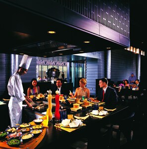 A buffet setup with various food items and a chef preparing food. - ITC Sonar, a Luxury Collection Hotel, Kolkata (Kolkata)