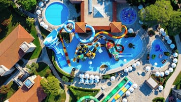 An aerial view of a water park with multiple slides and pools.