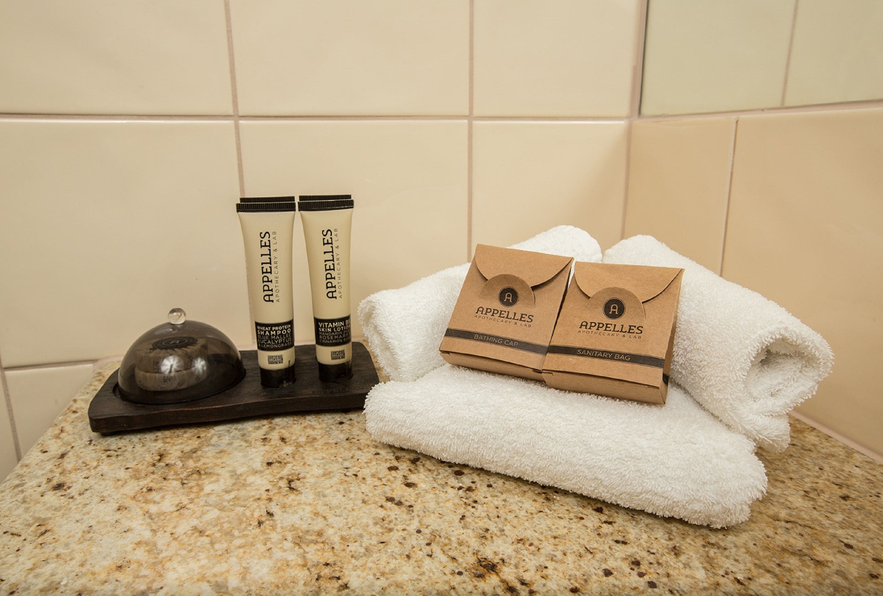 designer toiletries, hair dryer, bathrobes, towels