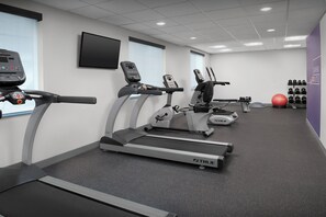 A gym with treadmills, a stationary bike, and a red exercise ball. - Holiday Inn Express Spokane Airport by IHG (Spokane)