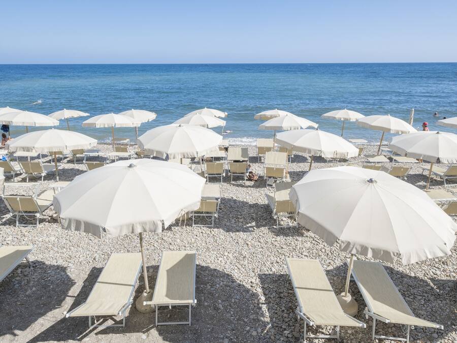 On the beach, sun loungers, beach umbrellas