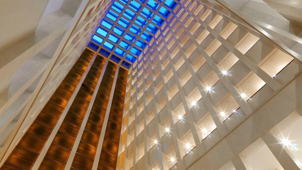 A modern building with a unique geometric design and a central skylight. - Berlin Marriott Hotel (Berlin)
