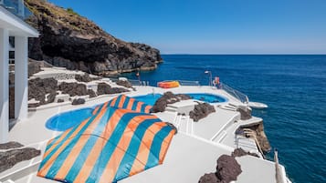 On the beach, sun loungers, beach umbrellas, beach towels