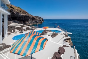 On the beach, sun loungers, beach umbrellas, beach towels