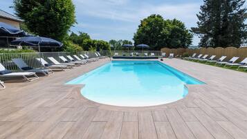 Seasonal outdoor pool, open 10:00 AM to 8:00 PM, pool umbrellas