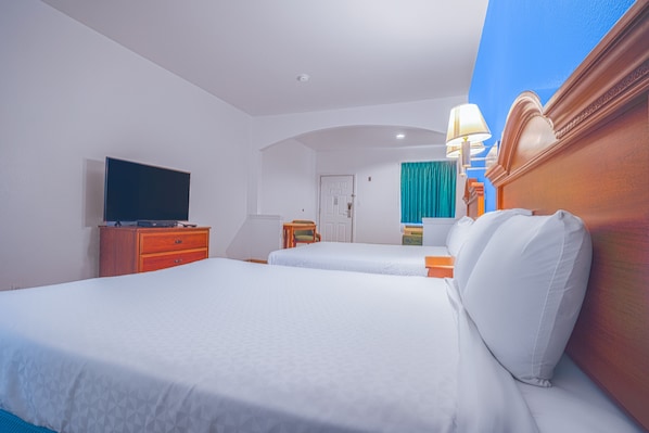 Deluxe Room, 2 Queen Beds, Non Smoking | Desk, iron/ironing board, free WiFi, bed sheets - Island Inn by OYO Galveston Beach, TX (Galveston)