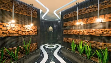 Experience the unique blend of texture and style in this thoughtfully designed space, featuring a striking pathway and lush greenery.