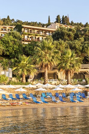 On the beach, sun loungers, beach umbrellas, beach towels