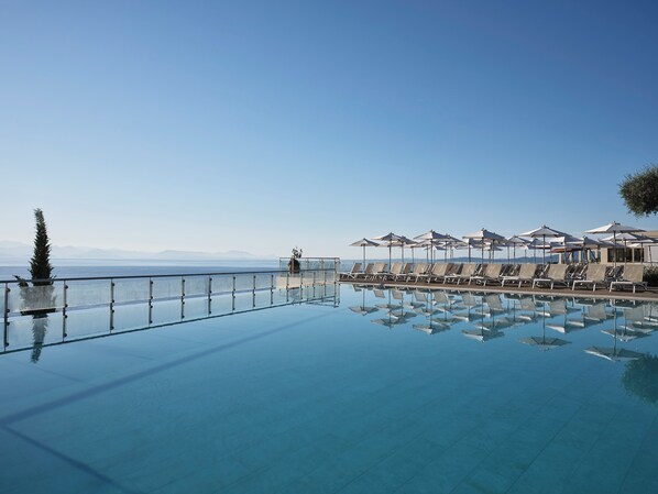2 outdoor pools, pool umbrellas, pool loungers