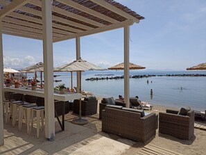 On the beach, sun-loungers, beach umbrellas, beach towels